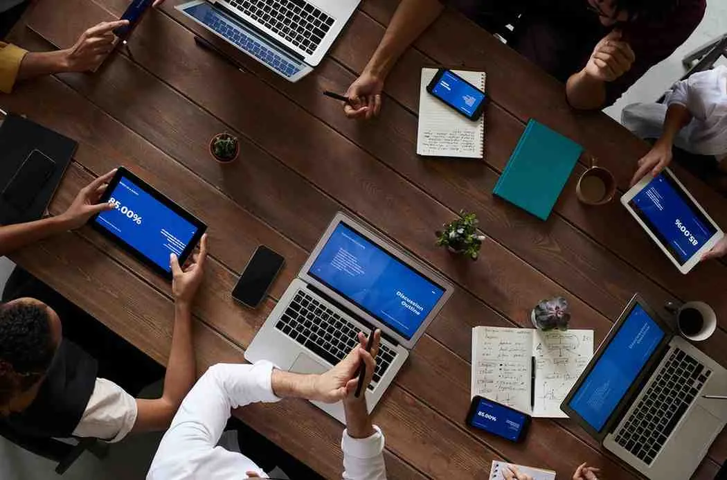 Top IT services team in 2025 using laptop and digital tabs at Galexy IT Solution